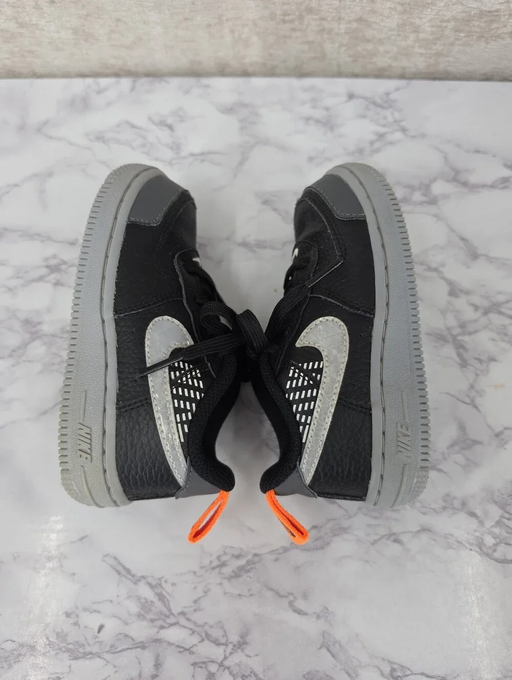 Nike Air Force Lv8 Kids Black & Gray Low-Top Sneakers with Orange Accent